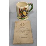 A Crown Devon 1937 Coronation mug A/F, together with a Book of Princess Elizabeth and Lieutenant