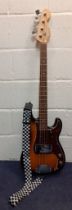 A Fender Squier Precision Bass 4 string guitar in a sunburst finish, label 'Crafted in China',