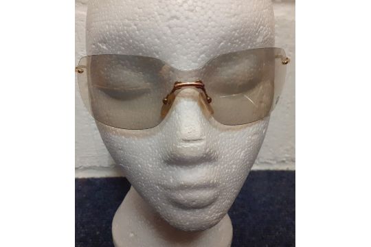 Christian Dior-A pair of vintage gold tone, frameless sunglasses having gold lenses together with an - Image 2 of 6