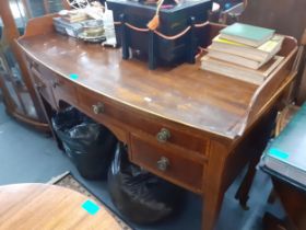 An Edwardian mahogany washstand having a raised back above four drawers and tapering legs 90h x 121W