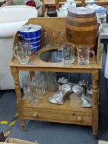 A mixed lot to include a pine washstand, some branded pub glasses, a gin flagon, and a set of four