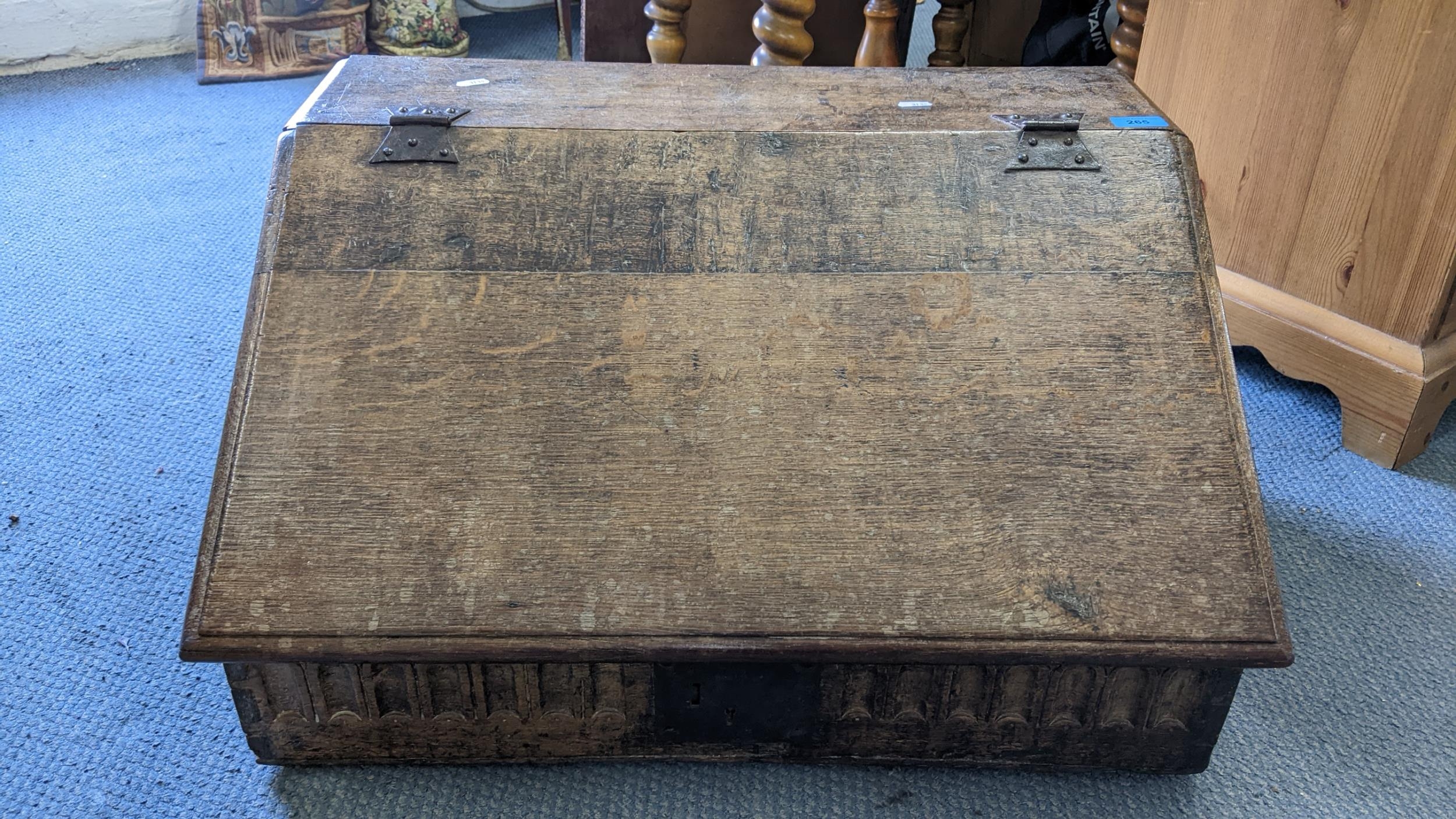 A late 17th/early 18th century oak bible box having carved panels and wrought iron supports, 33. - Image 2 of 3