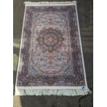 A contemporary machine woven acrylic Persian rug with central flower medallion, all over floral