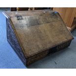 A late 17th/early 18th century oak bible box having carved panels and wrought iron supports, 33.