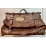 A vintage large brown leather Gladstone cruise cabin bag having a cloth interior, 4 leather