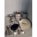 Silver to include two modern tea caddy spoons fashioned as jockey hats, a money clip, three lidded