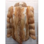 A 1970's red fox fur jacket, 38" chest x 29" long. Location:Rail