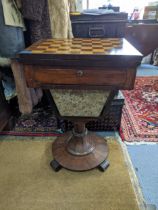A 19th century rosewood and maple games/work table with a rotating fold over top Location: