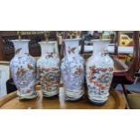 Two pairs of Oriental style porcelain table lamps to include one pair decorated with birds perched