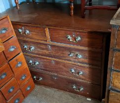 A George III mahogany chest of two short and three long drawers, the upper section of a chest on