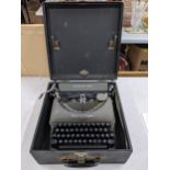 A vintage cased Remington typewriter in a black travel case Location: