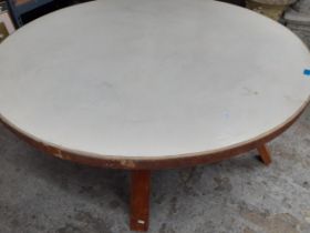A mid 20th century Bowman & Bros London town, walnut veneered circular table on four legs with