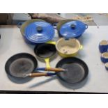 Le Creuset cooking pans and pots, including one saucepan, three frying pans and two cooking pots