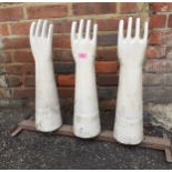 A set of three vintage ceramic latex glove moulds, on a metal stand produced by AHG Location: BWR