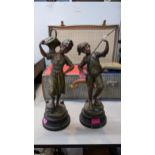 A pair of late 19th century French Victorian spelter figurines, signed near the base H. Tremo,