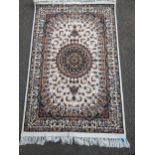 A small contemporary Persian machine woven polyester filament rug, central floral medallion, with