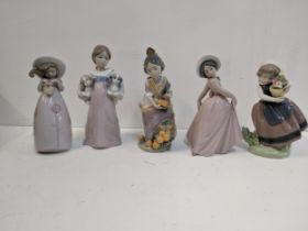 Five Lladro figures to include a girl with a basket of oranges, baskets of flowers and puppies