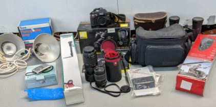 Mixed photography items to include a Nikon D5100 18-55 VR kit, a Tamron AF 70-300mm, a Monopod, a