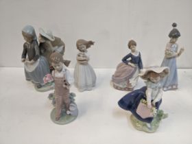 Six Lladro figures to include a boy and a girl group children with flowers, a lady and girl
