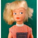 A 1970's Patch in a jean dungaree with red checked top outfit, blonde hair together with a Brownie