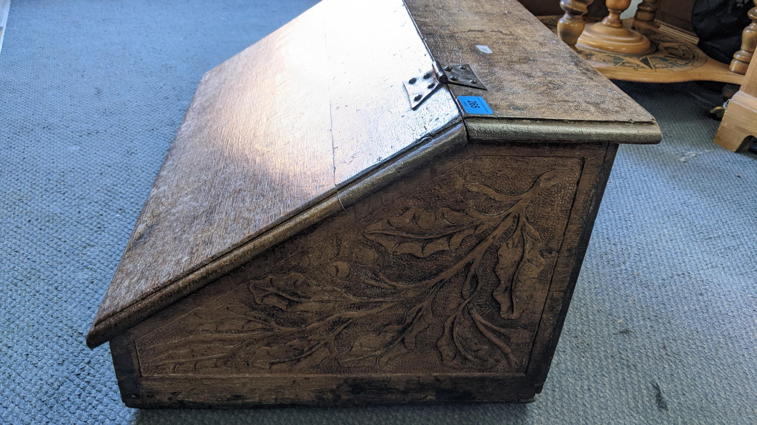 A late 17th/early 18th century oak bible box having carved panels and wrought iron supports, 33. - Image 3 of 3