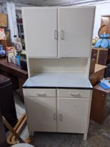 A 1950s/60s painted kitchen cabinet with a shelved interior, two top doors, an enamel work