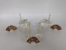 A collection of six stamped 925 sterling silver menu holders in the form of Oriental figures and