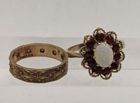 A 9ct gold ring inset with an oval opal and garnets, total weight 3.8g, together with a 9ct gold