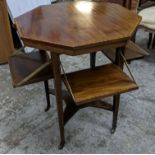 An Edwardian mahogany octagonal topped table with four hinged lower shelves, 71.5cm h x 61cm w