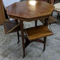 An Edwardian mahogany octagonal topped table with four hinged lower shelves, 71.5cm h x 61cm w