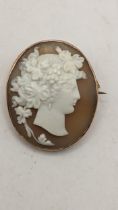 A 9ct gold framed shell cameo brooch depicting a maiden, 7.1g Location: