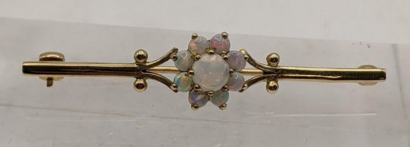 A 9ct gold bar brooch set with opals, total weight 3g Location: