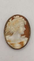 A 9ct gold framed shell cameo brooch in a rope twist mount, 24.5g Location: