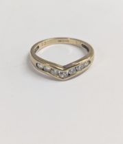 A 9ct gold chevron ring inset with seven glass stones, size K, together with a gold plated curb link