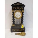 A 19th century ebonized portico clock faced with an enamelled Roman dial and raised on barley