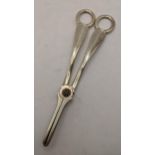 An early 20th century silver pair of grape scissors, engraved with the initials N, 139.5g Location: