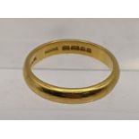 A 22ct gold wedding band, total weight 5g Location: