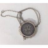 A George III 1820 garter silver crown, in a white metal pendant on a chain Location: