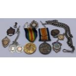 Collectables to include two WWI medals GNR RA 313064, a silver watch chain and medallions, 130g