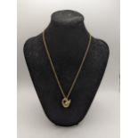 A 9ct gold necklace with a 9ct gold pendant in the form of a swan, total weight 6.6g Location: