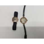 Two early 20th century 9ct gold cased manual winding wrist watches, one having a leather strap,