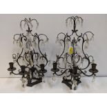 A pair of metal three branch candelabra with glass drops Location: