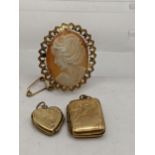 A 9ct gold cameo brooch, together with two 9ct gold lockets, total weight 10g Location: