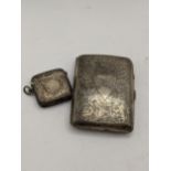 A Birmingham 1922 silver cigarette case with a floral embossed design, together with a silver