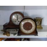 Four early 20th century clocks to include a carriage clock, two mantel clocks and a movement swinger