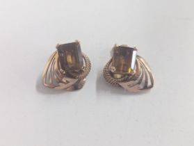 A pair of stamped 18 gold, Art Deco inspired earrings inset with central citrinin, 11.1g, total