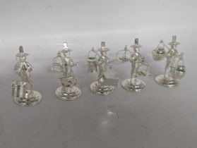 A collection of five stamped 925 sterling silver menu holders in the form of Oriental figures,