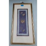 An early 20th Century Chinese embroidered panel on a blue ground with metallic gold and silver