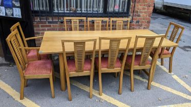 A modern light oak dining table and matching chairs by Batheaston Chairmakers of Corsham