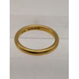 A 22ct gold wedding band, total weight 5.8g Location: